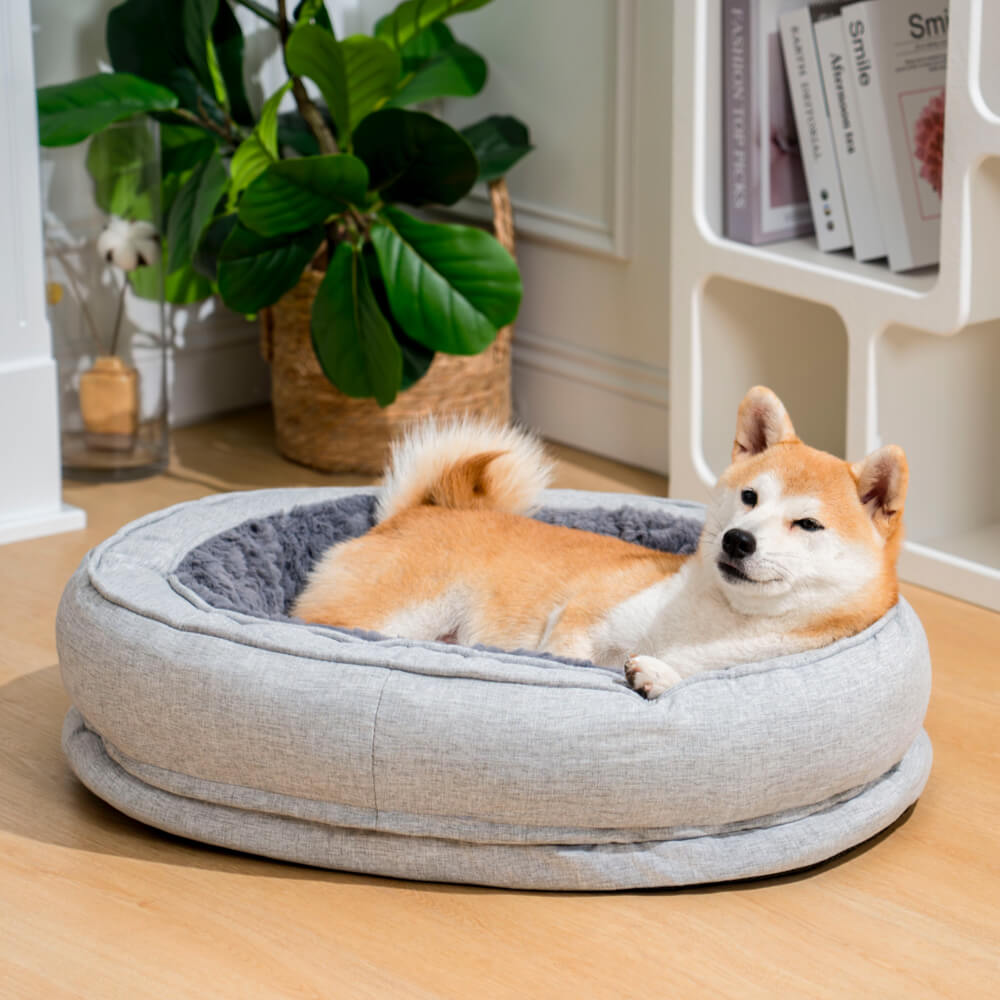 A dog in the Plush Grey bed
